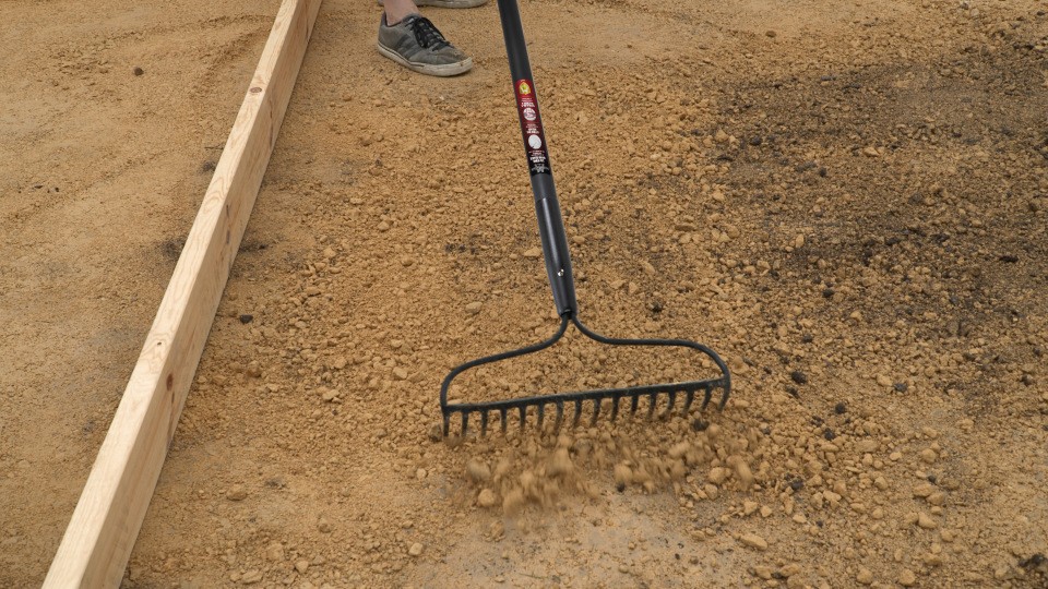 leveling gravel with the bow rake